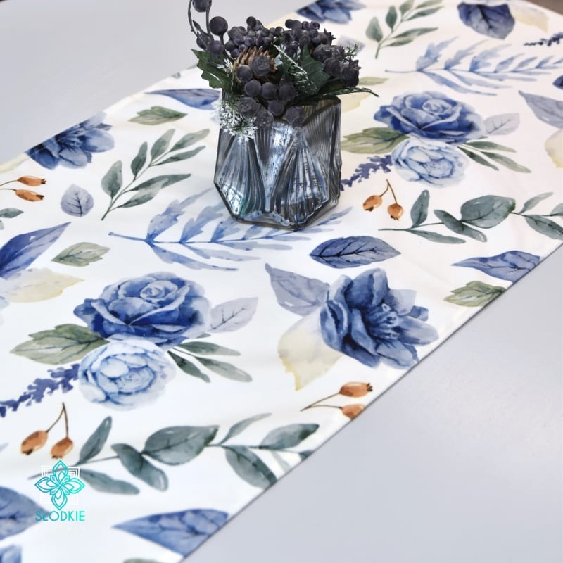 Decorative table runner with blue roses